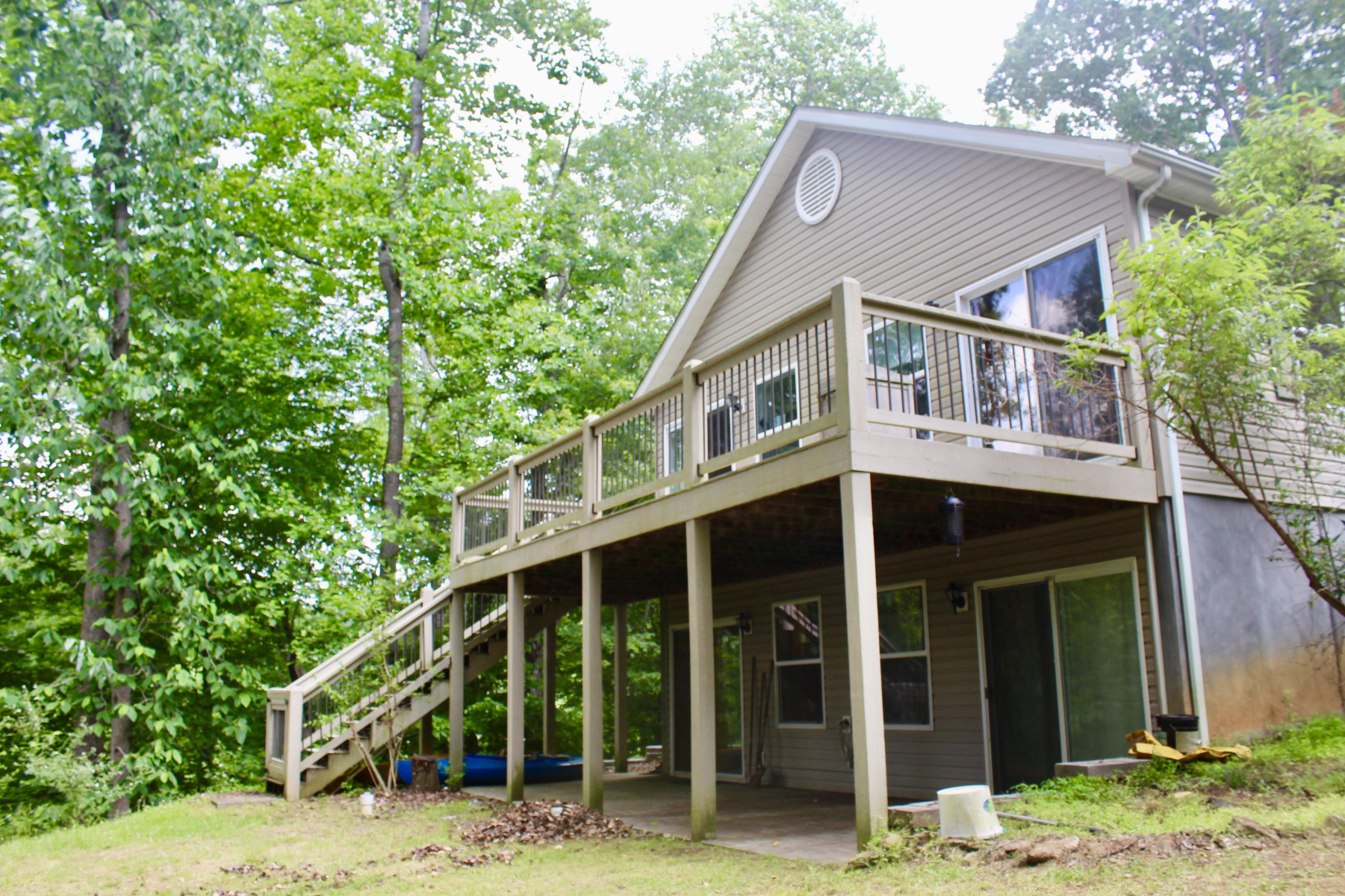 224 Board Mountain Road Goodview, VA 24095 - Photo 2 of 17 a front view of a house with a garden