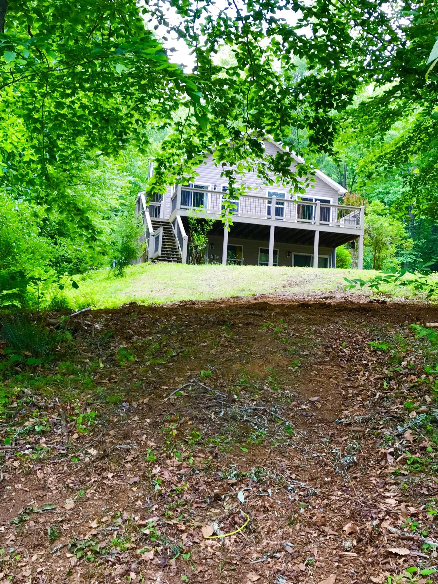 224 Board Mountain Road Goodview, VA 24095 - Photo 14 of 17 a front view of a house with a yard