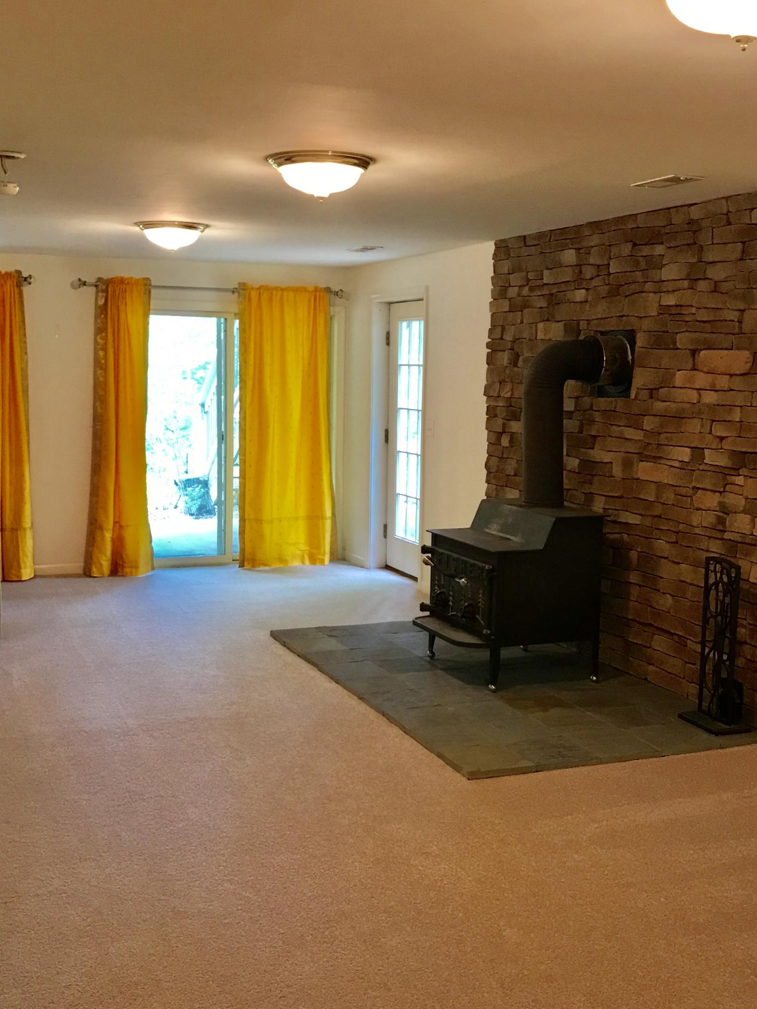 224 Board Mountain Road Goodview, VA 24095 - Photo 16 of 17 a living room with furniture and a fireplace