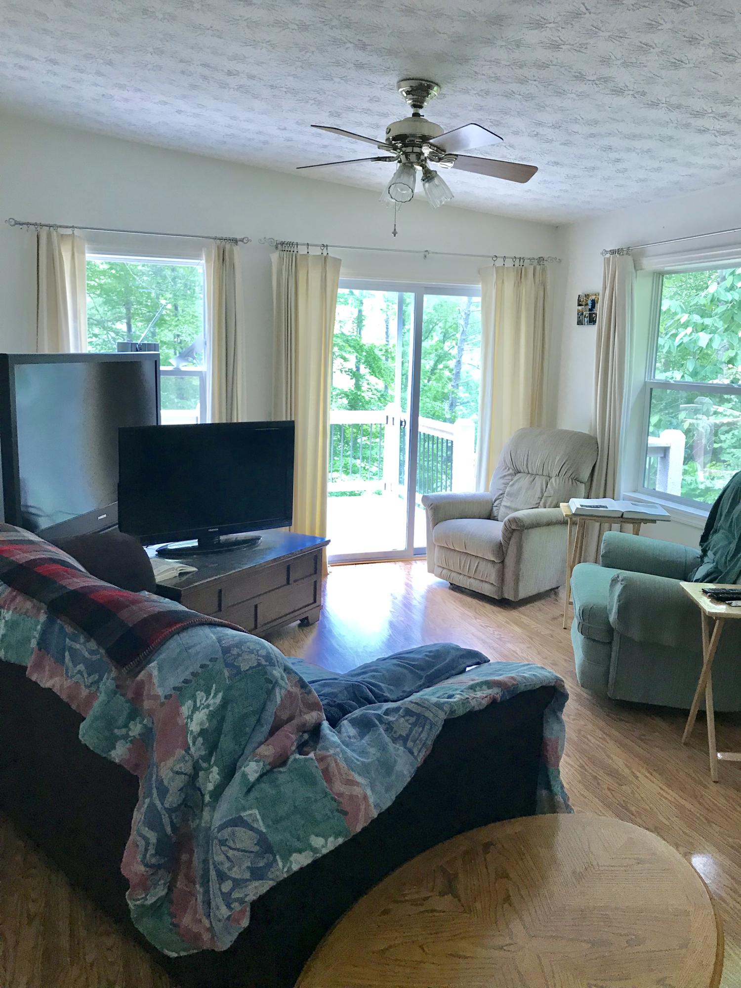 224 Board Mountain Road Goodview, VA 24095 - Photo 4 of 17 a living room with furniture and a flat screen tv