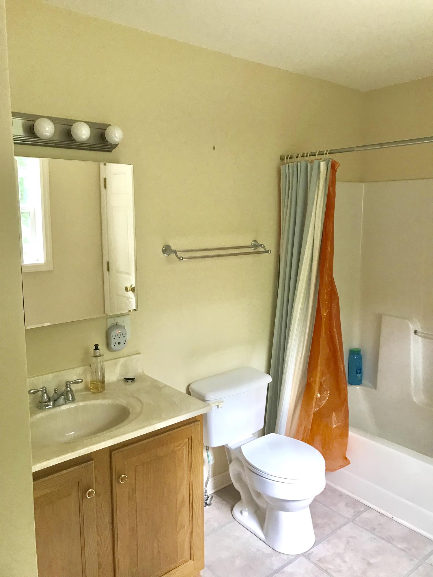 224 Board Mountain Road Goodview, VA 24095 - Photo 8 of 17 a bathroom with a sink toilet and shower