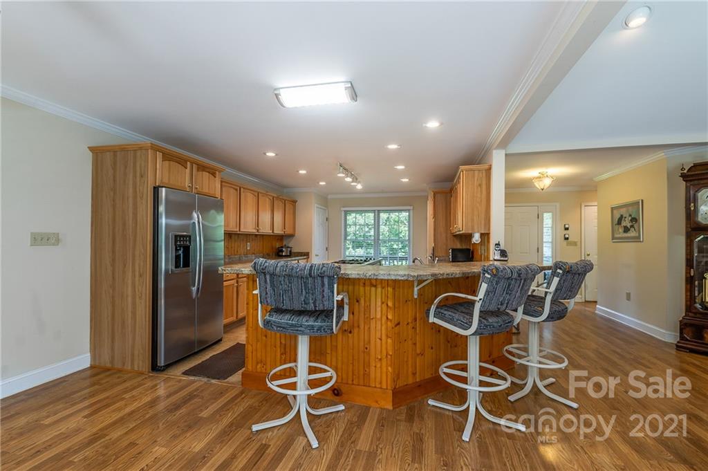 3182 Polk County Line Road Rutherfordton, NC 28139 - Photo 10 of 48 a view of a dining room with furniture window and wooden floor