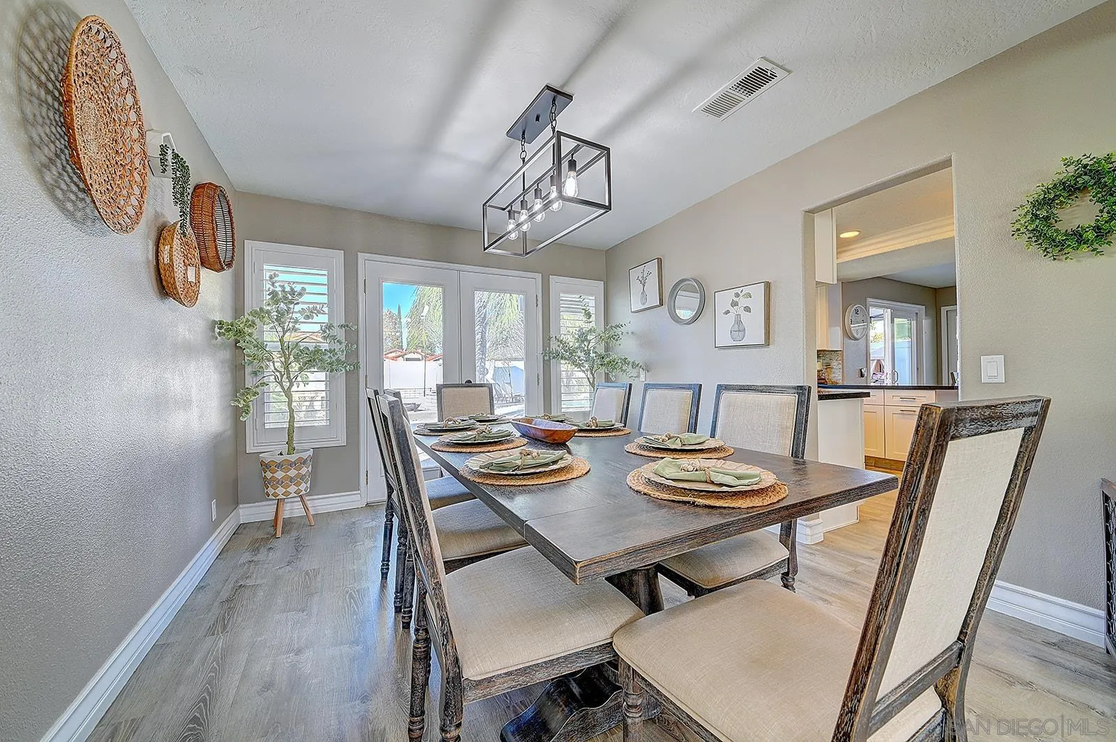 45774 Hopactong Street Temecula, CA 92592 - Photo 10 of 26 a view of a dining room with furniture and wooden floor