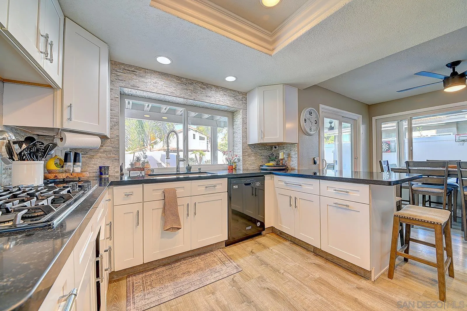 45774 Hopactong Street Temecula, CA 92592 - Photo 11 of 26 a kitchen with stainless steel appliances granite countertop a stove a sink and a refrigerator