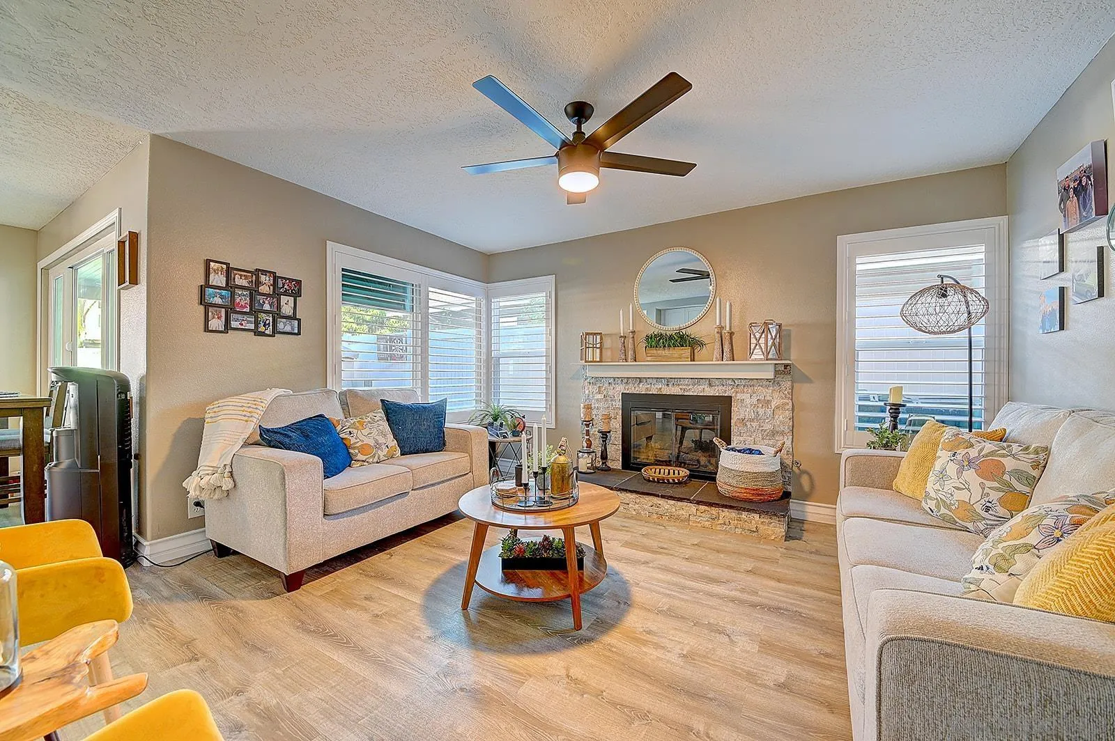 45774 Hopactong Street Temecula, CA 92592 - Photo 14 of 26 a living room with furniture a fireplace and a large window