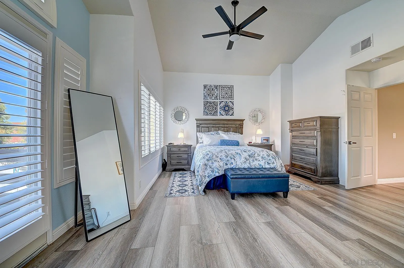 45774 Hopactong Street Temecula, CA 92592 - Photo 15 of 26 a bedroom with a bed closet and a window