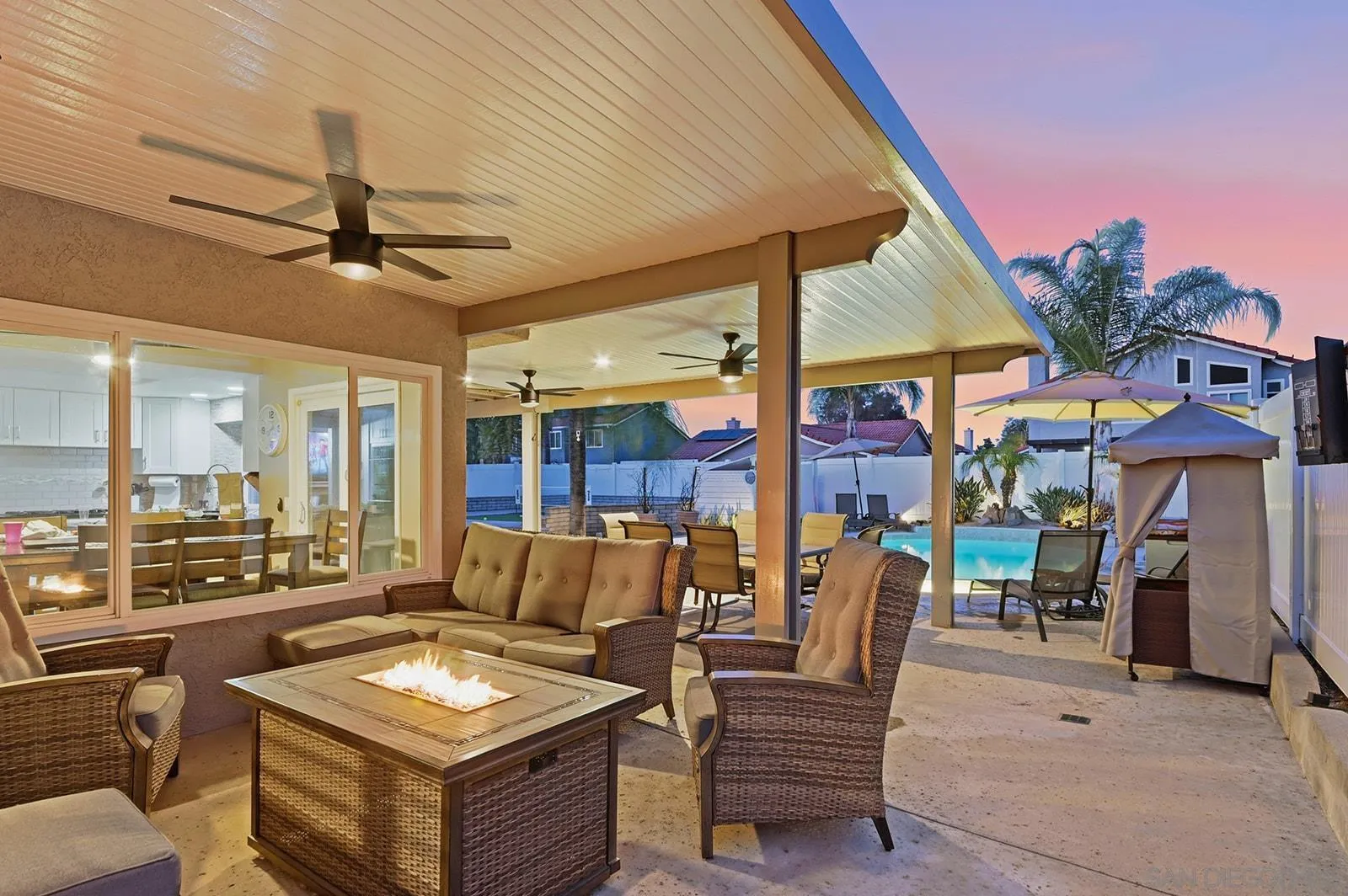 45774 Hopactong Street Temecula, CA 92592 - Photo 19 of 26 a view of a patio with a dining table and chairs