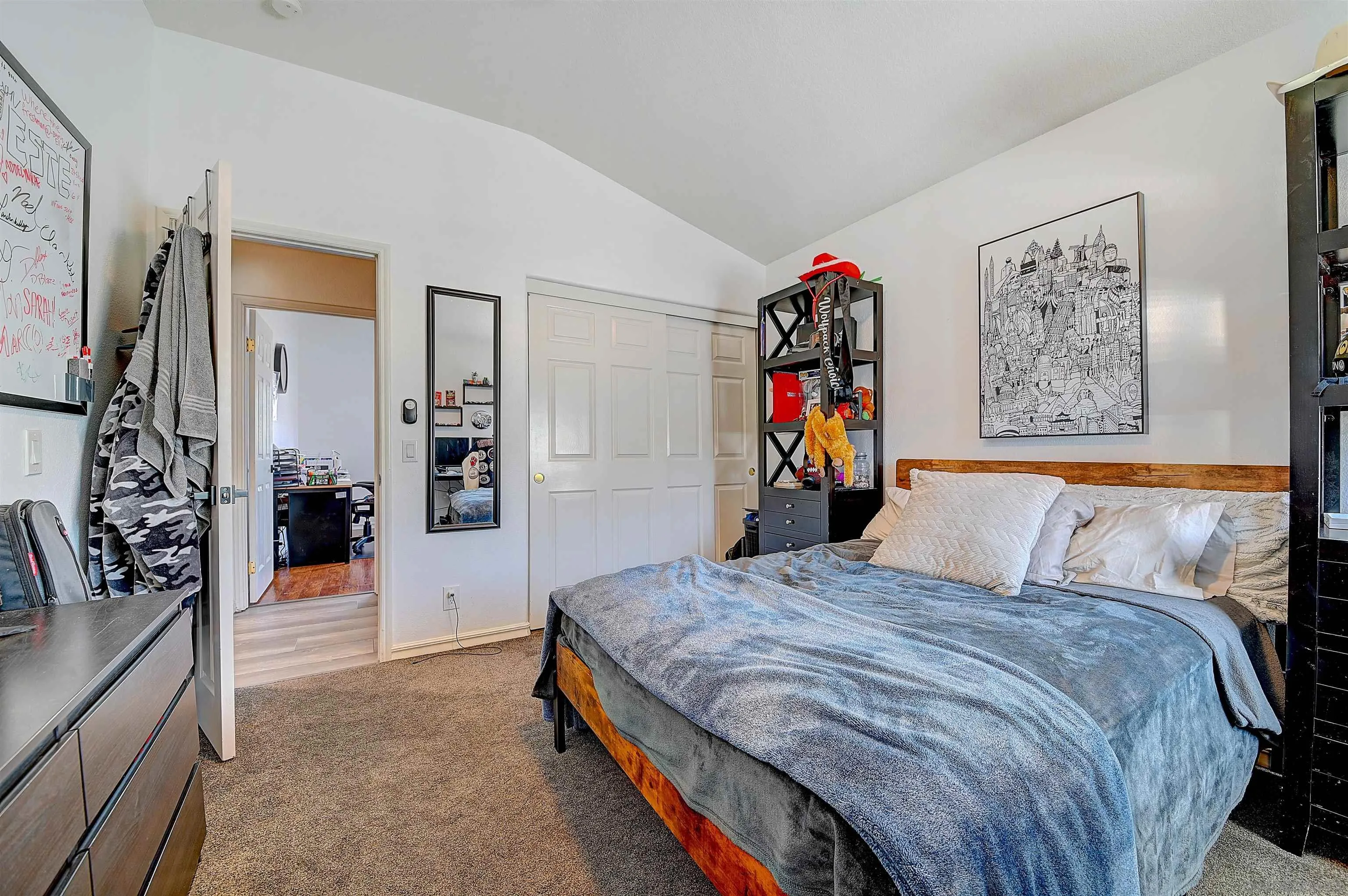 45774 Hopactong Street Temecula, CA 92592 - Photo 22 of 26 a bedroom with a large bed and a chandelier