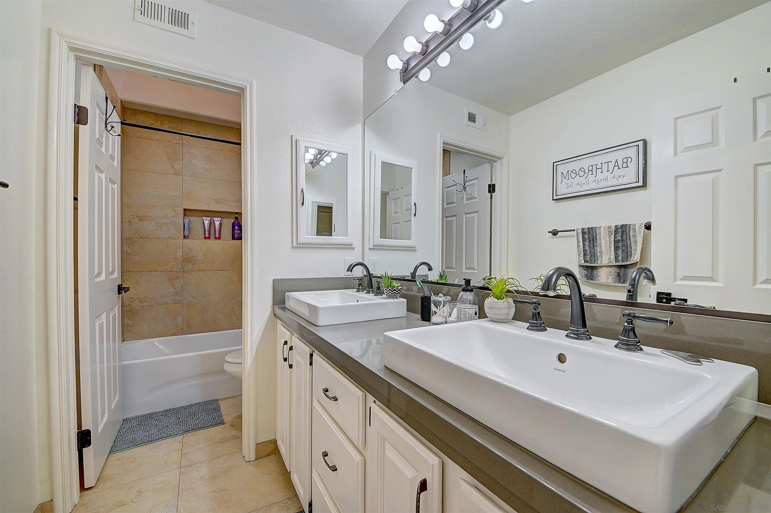 45774 Hopactong Street Temecula, CA 92592 - Photo 24 of 26 a bathroom with a sink double vanity and a mirror