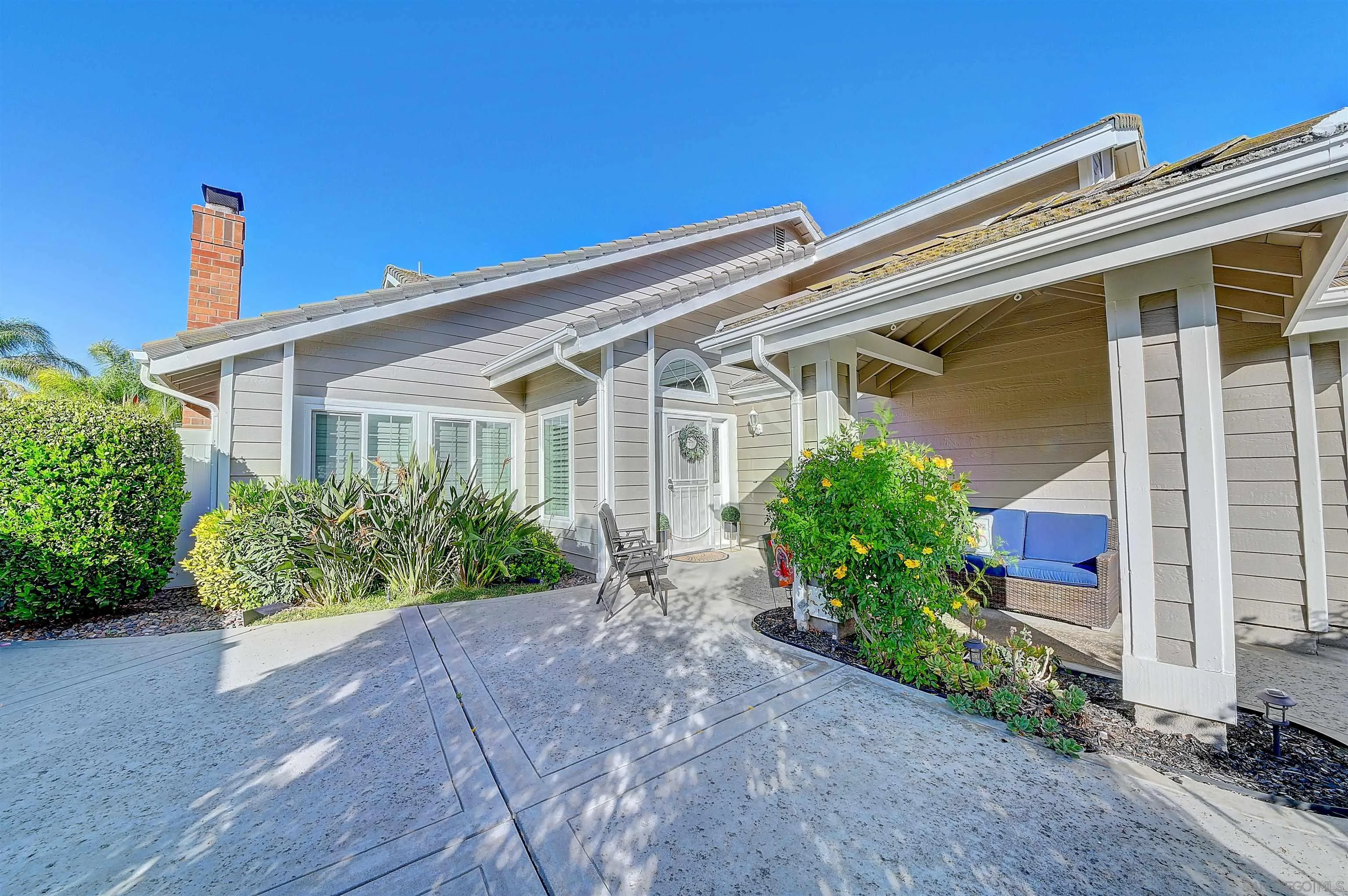 45774 Hopactong Street Temecula, CA 92592 - Photo 25 of 26 front view of a house with potted plants