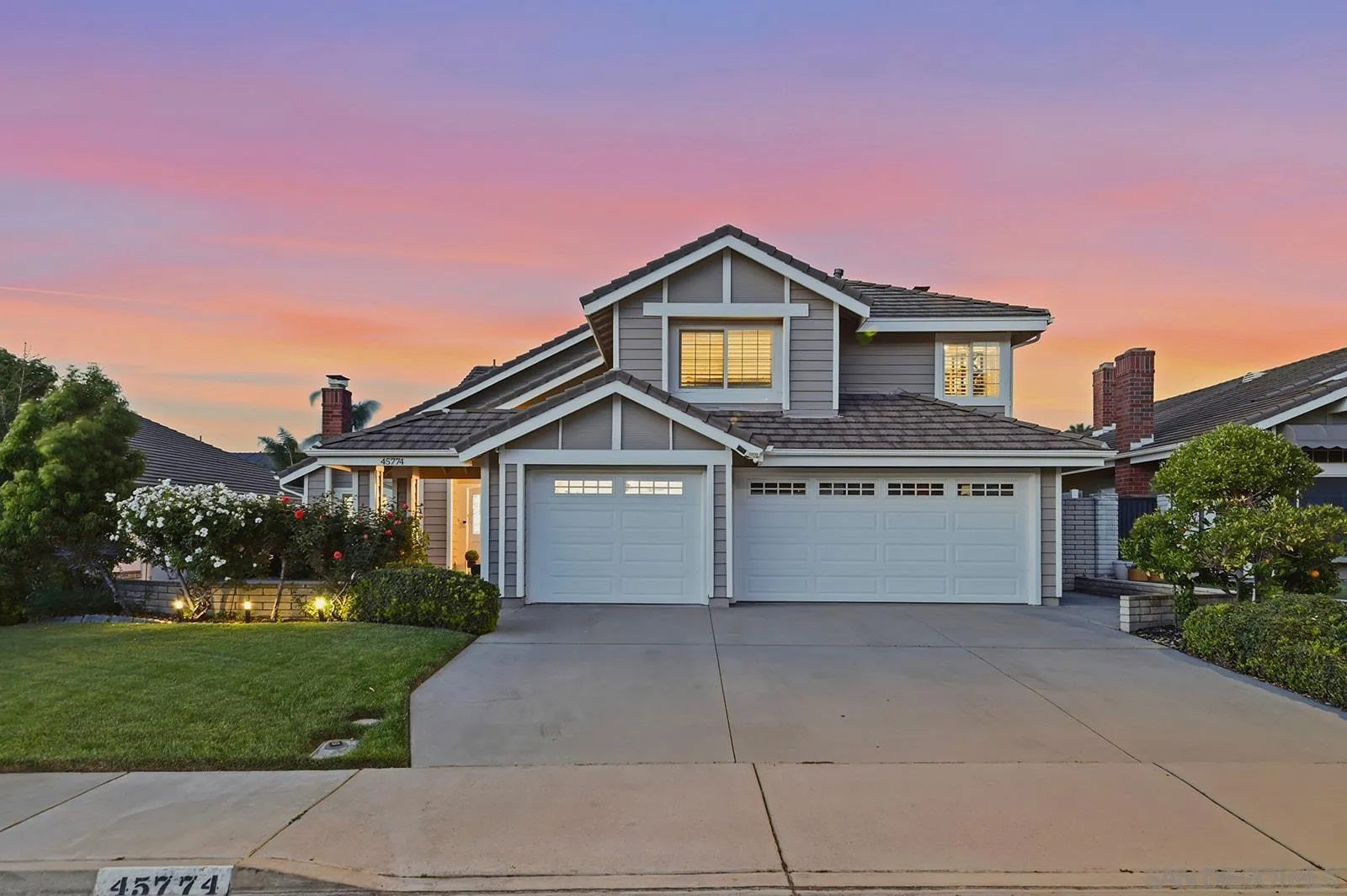 45774 Hopactong Street Temecula, CA 92592 - Photo 3 of 26 a front view of a house with a yard