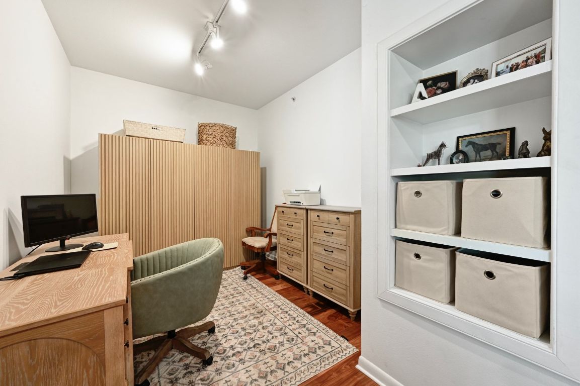 54 Rainey Street, Unit 416 Austin, TX 78701 - Photo 12 of 40 Office with dark wood-type flooring and track lighting
