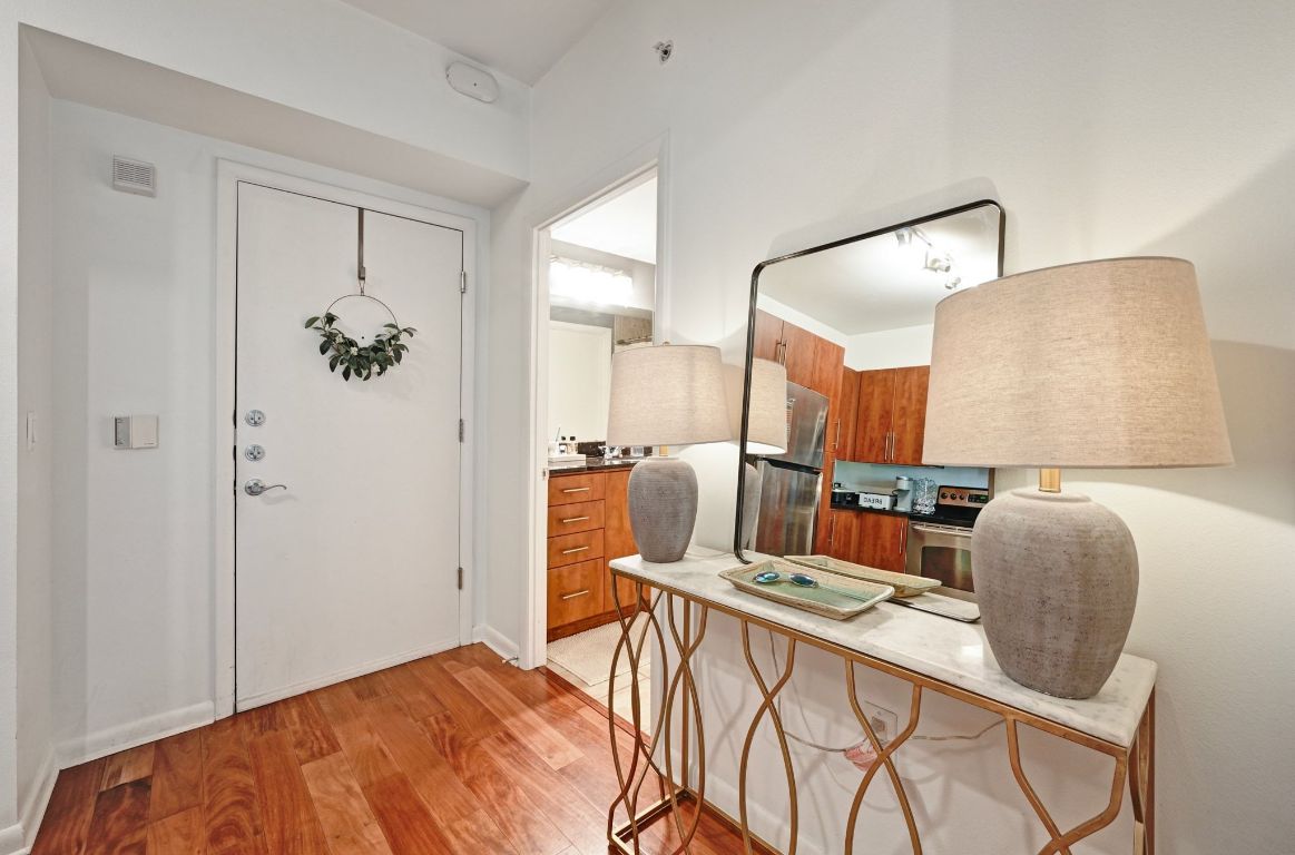 54 Rainey Street, Unit 416 Austin, TX 78701 - Photo 2 of 40 Entrance foyer featuring wood floors