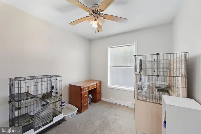 a view of a storage & utility room with racks on the wall