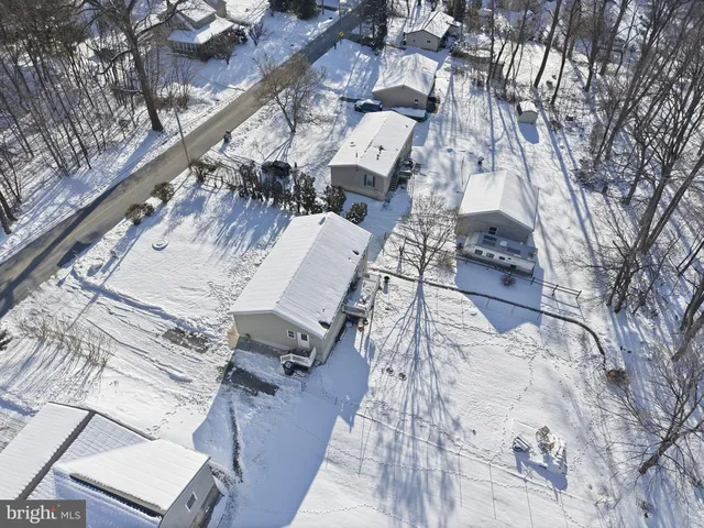 a view of a patio with table and chairs