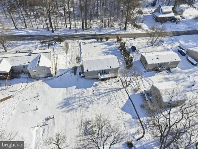 an aerial view of residential house with outdoor space