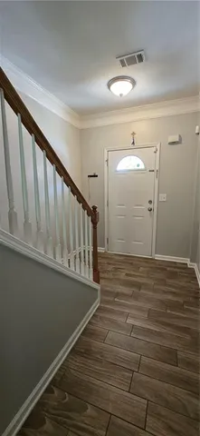 a view of entryway with wooden floor