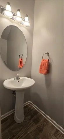 a bathroom with a sink and mirror