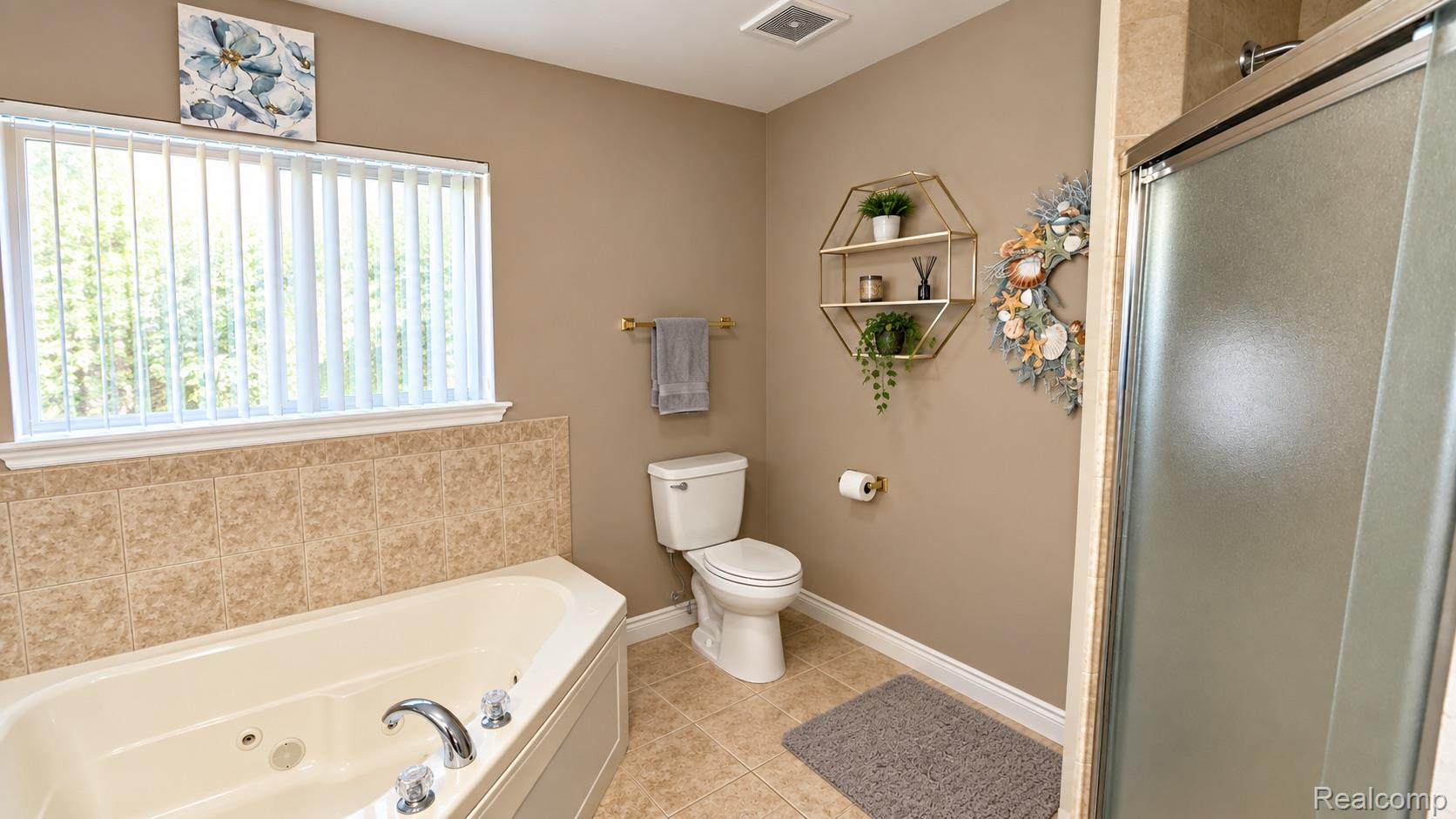 15818 East 14 Mile Road Fraser, MI 48026 - Photo 14 of 26 Corner soaking tub with tile surround, separate shower with frosted glass enclosure, tile flooring, and a window with vertical blinds