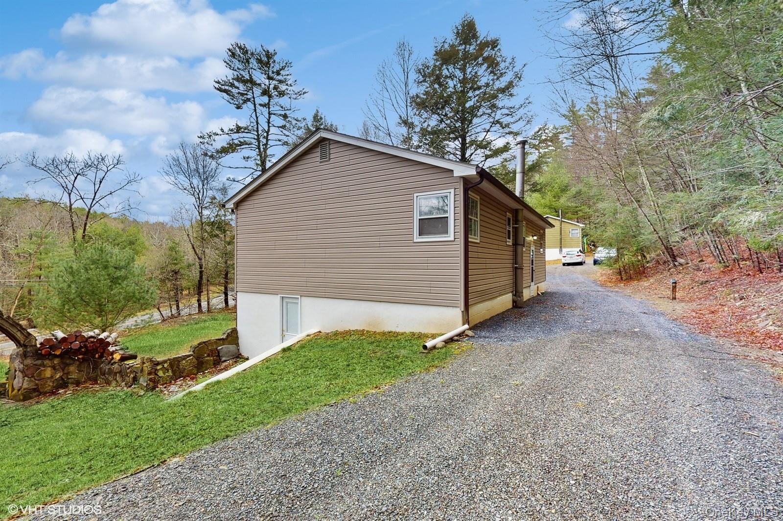 736 State Rte 55 Napanoch, NY 12458 - Photo 25 of 49 View of property exterior with a yard and driveway