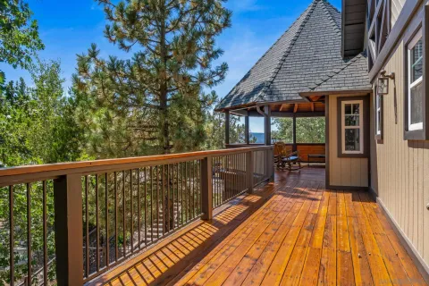 a view of balcony with wooden floor