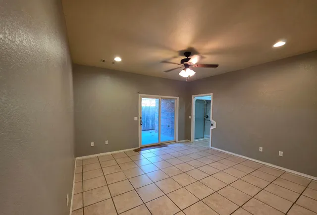 a view of a livingroom with a chandelier fan