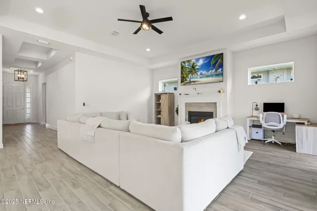 a living room with furniture white walls and white walls