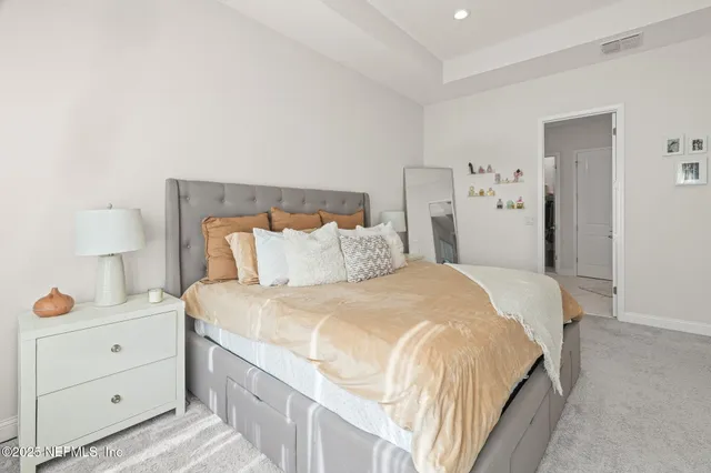 a view of a bathroom with a sink and mirror