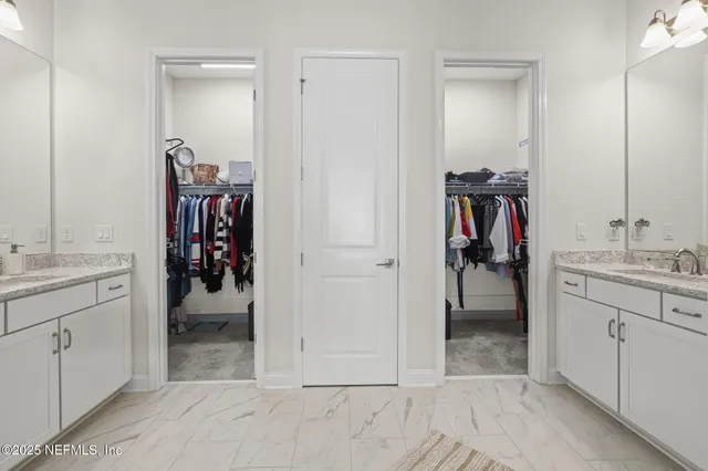 a living room with furniture and a ceiling fan