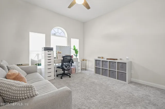 a bathroom with a sink a toilet and shower curtain
