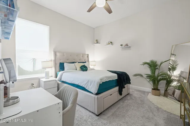 a bathroom with a shower a sink and a mirror