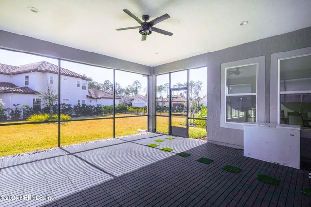 a view of a livingroom with furniture and a window