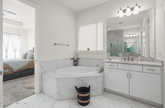 a bathroom with a sink double vanity and a mirror