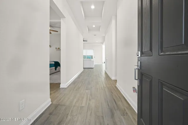 a view of room with window and wooden floor
