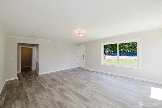 a view of an empty room with a window