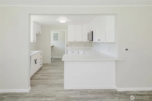 a view of a kitchen with electric appliances