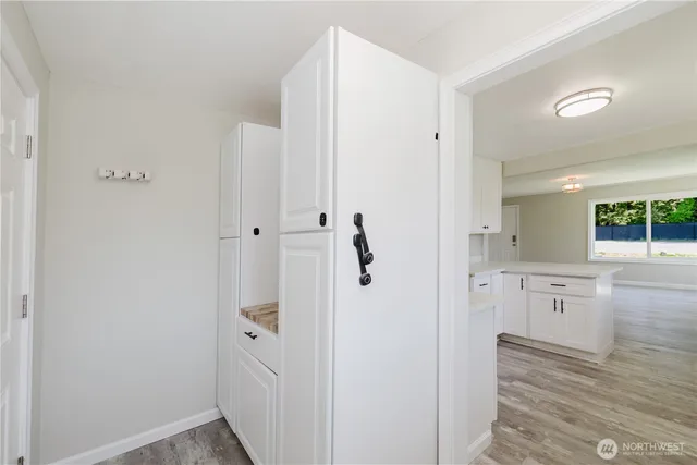 a bathroom with a granite countertop mirror and a sink