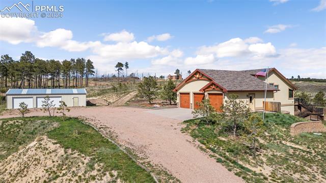 7115 Wildridge Road Colorado Springs, CO 80908 - Photo 2 of 49 View of front of property from the drive