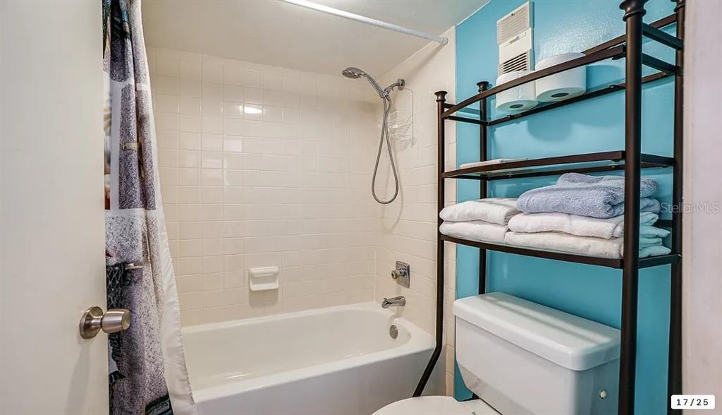 6009 Sea Ranch Drive, Unit 208 Hudson, FL 34667 - Photo 12 of 22 a bathroom with a sink toilet and shower