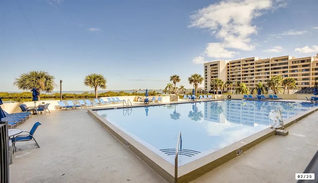 6009 Sea Ranch Drive, Unit 208 Hudson, FL 34667 - Photo 17 of 22 a view of a swimming pool with outdoor seating