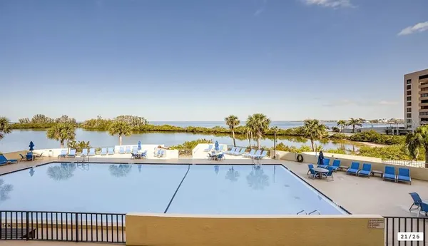 a view of a swimming pool with an ocean view