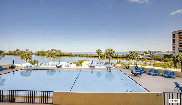 a view of a swimming pool with an ocean view