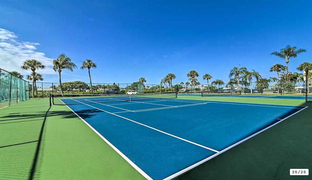6009 Sea Ranch Drive, Unit 208 Hudson, FL 34667 - Photo 20 of 22 a view of a tennis court
