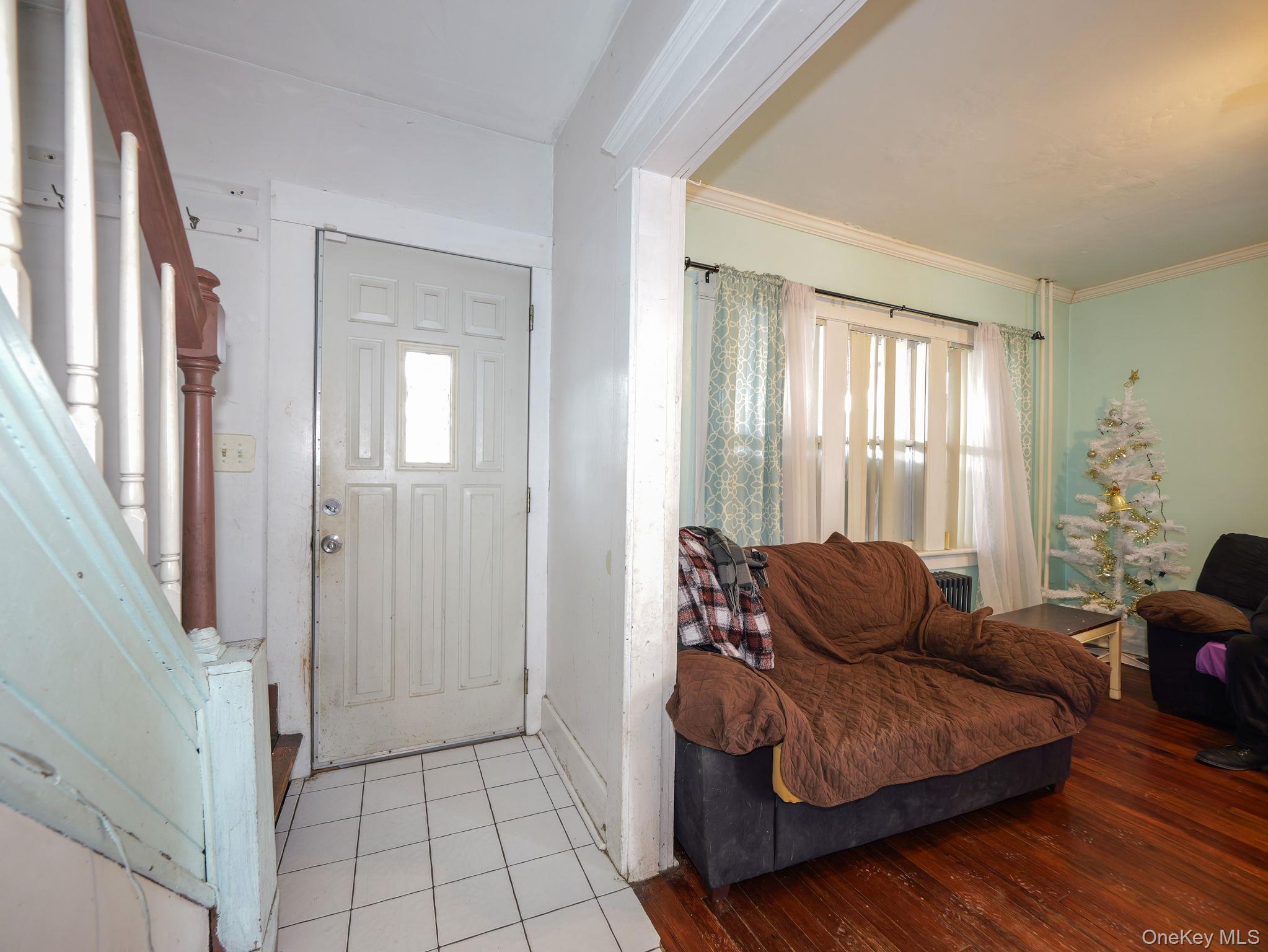 809 South Street Newburgh, NY 12550 - Photo 13 of 45 a living room with furniture and a window
