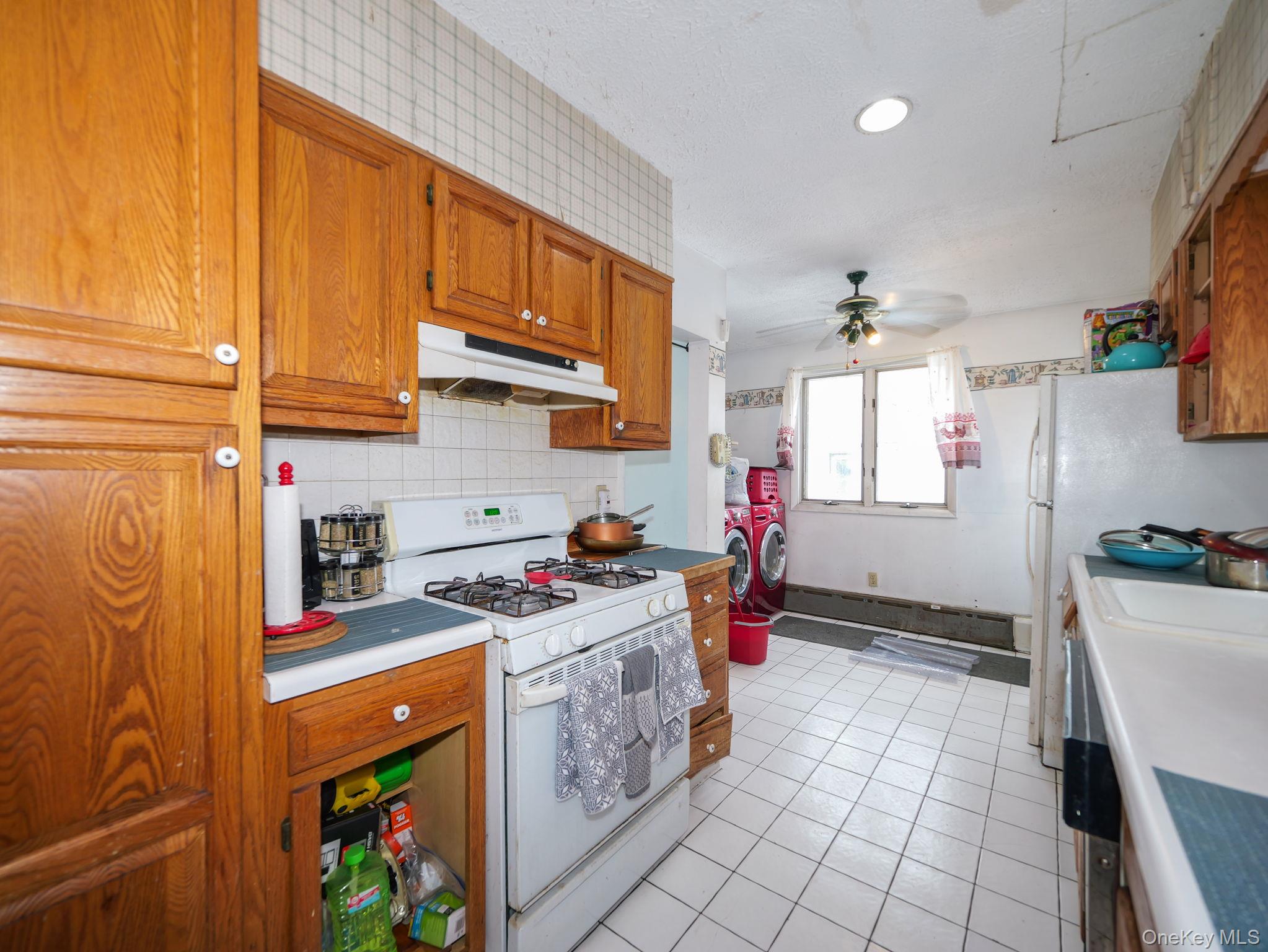809 South Street Newburgh, NY 12550 - Photo 17 of 45 a kitchen with stainless steel appliances granite countertop a sink stove and refrigerator
