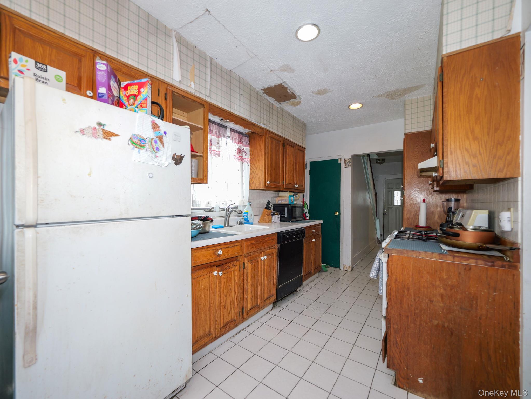 809 South Street Newburgh, NY 12550 - Photo 18 of 45 a kitchen with stainless steel appliances granite countertop a refrigerator a stove a sink and a refrigerator
