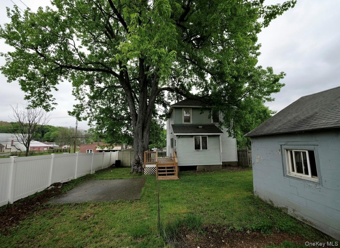 809 South Street Newburgh, NY 12550 - Photo 23 of 45 a front view of a house with a yard and trees