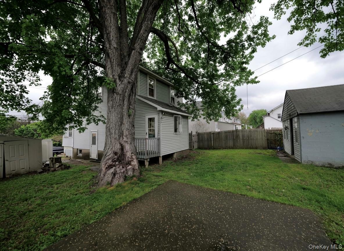 809 South Street Newburgh, NY 12550 - Photo 25 of 45 a backyard of a house with table and chairs