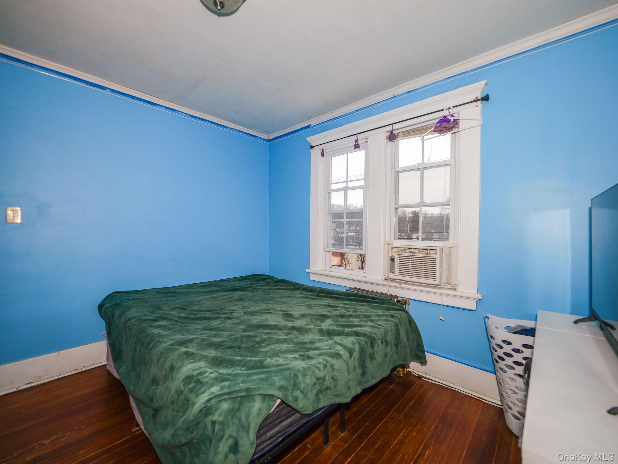 809 South Street Newburgh, NY 12550 - Photo 35 of 45 a view of a bedroom with wooden floor and a window