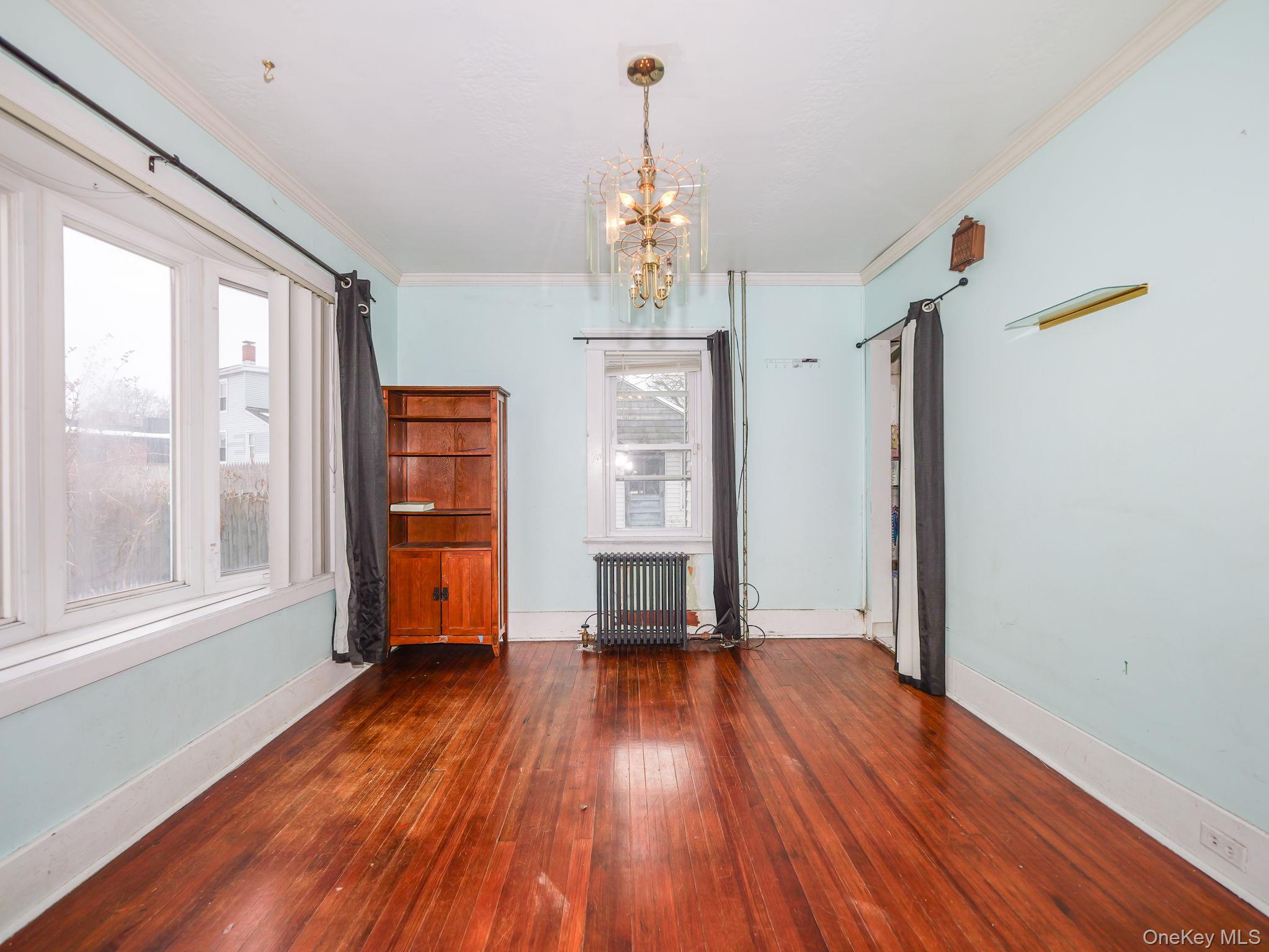 809 South Street Newburgh, NY 12550 - Photo 4 of 45 a view of empty room with wooden floor and fan